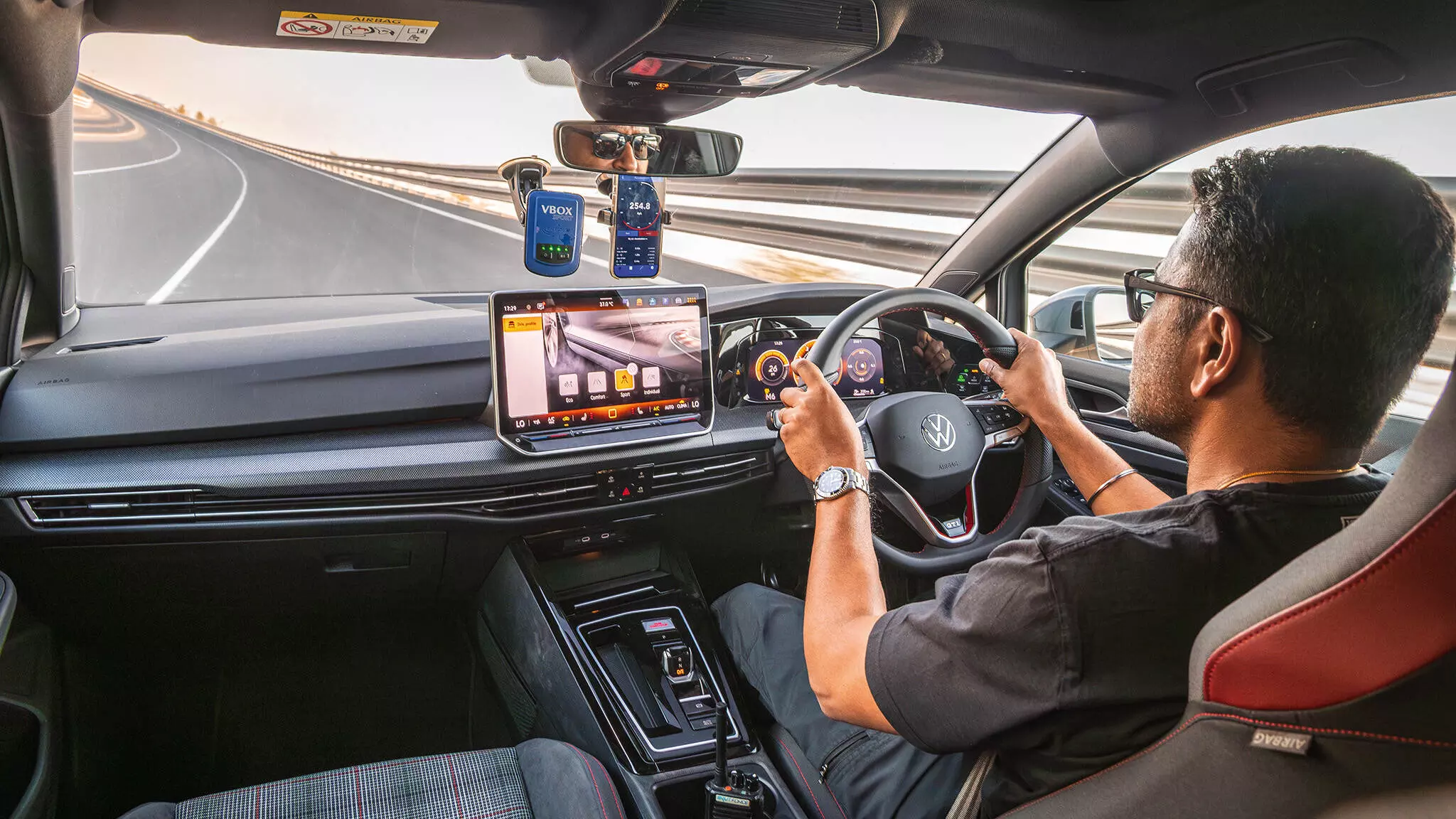 The VW Golfs interior is tailored for enthusiasts with the tartan-clad fabric seats which are also heated; the GTI steering wheel is thick-rimmed and perfectly contoured — Shot by Avdhoot A Kolhe for evo India The VW Golfs interior is tailored for enthusiasts with the tartan-clad fabric seats which are also heated; the GTI steering wheel is thick-rimmed and perfectly contoured — Shot by Avdhoot A Kolhe for evo India