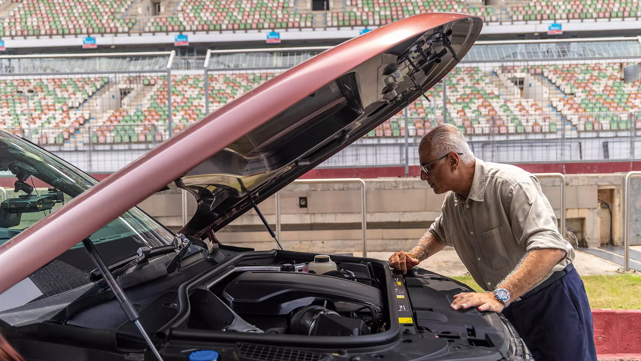 Raj Kapoor, adjudicator, FMSCI in attendance to validate the lap time and marvel at the 4.4-litre twin-turbo V8 — Shot by Rohit G Mane for evo India Raj Kapoor, adjudicator, FMSCI in attendance to validate the lap time and marvel at the 4.4-litre twin-turbo V8 — Shot by Rohit G Mane for evo India