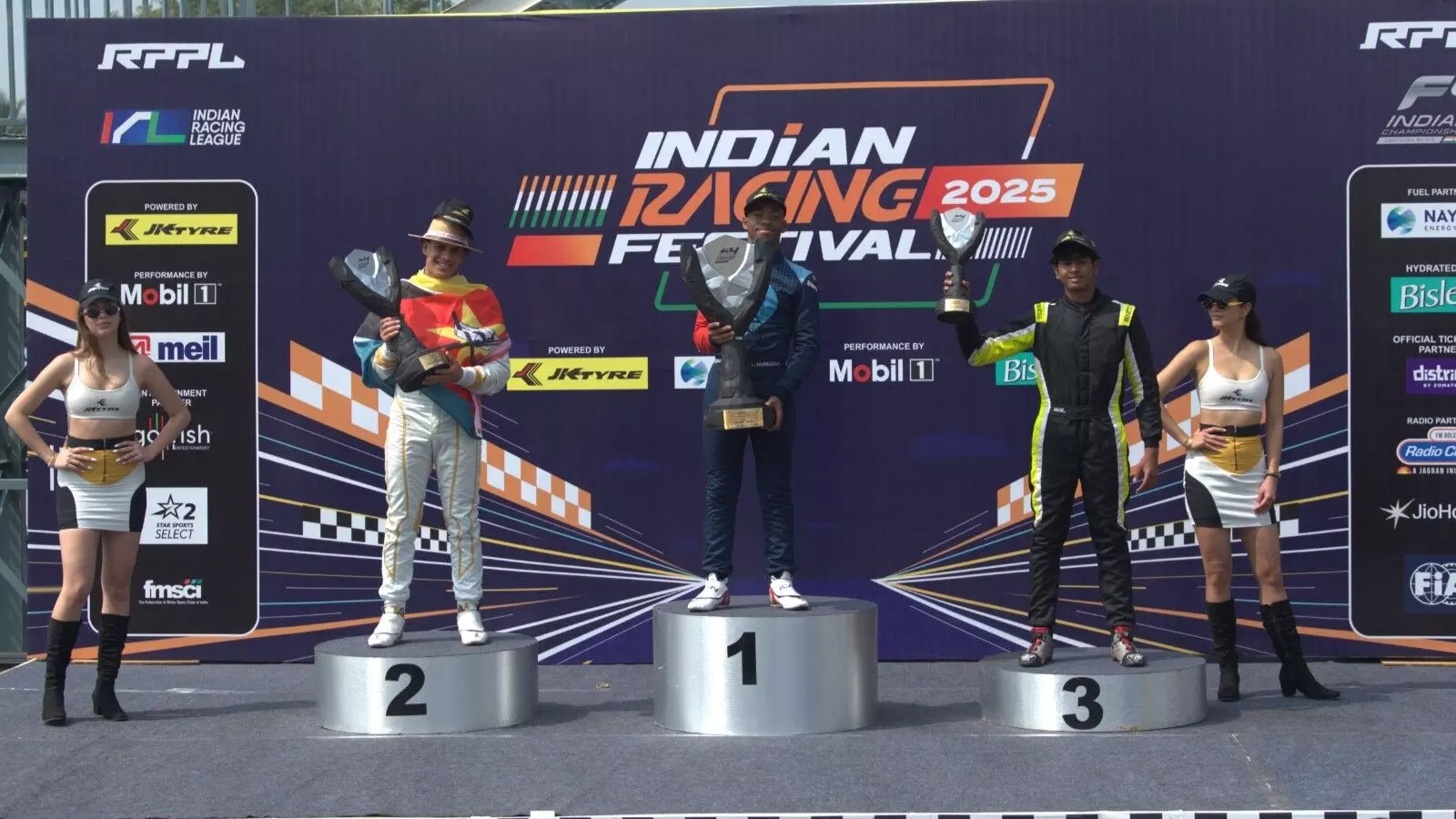 (L- R) Ghazi Motlekar (Kolkata Royal Tigers), Luviwe Sambudla (Goa Aces JA Racing) and Ishaan Madesh (Kolkata Royal Tigers) on the Formula 4 IC podium