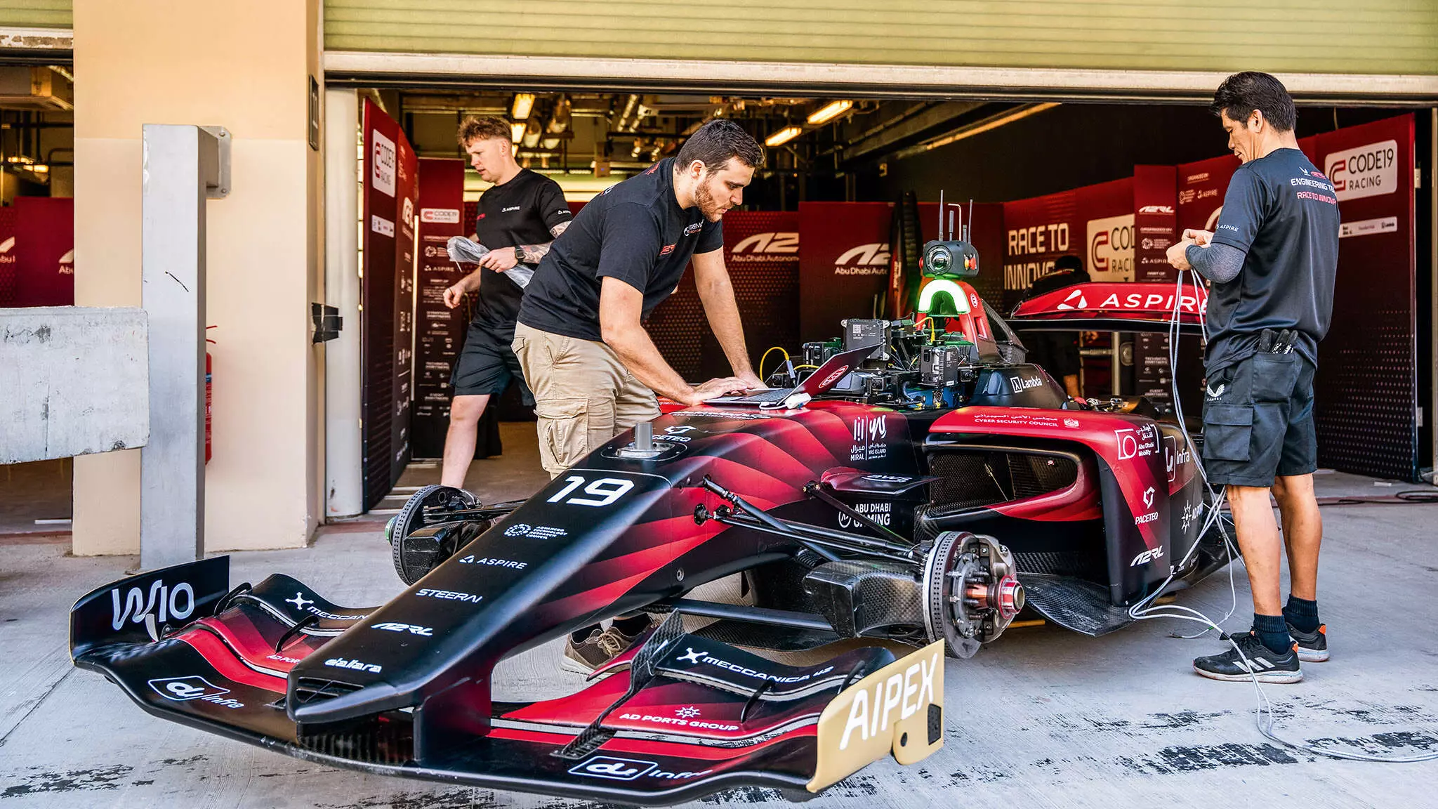 Teams run thorough checks of their autonomous stack before sending the autonomous car on track — Shot by Spacesuit Media & A2RL Teams run thorough checks of their autonomous stack before sending the autonomous car on track — Shot by Spacesuit Media & A2RL