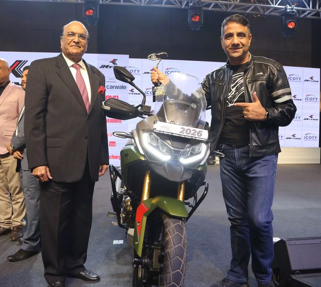 Dr. Raghupati Singhania, Chairman & Managing Director, JK Tyre & Industries Limited (left) with Vimal Sumbly, Head Business – Premium, TVS Motor Company (right) at the 2026 IMOTY awards