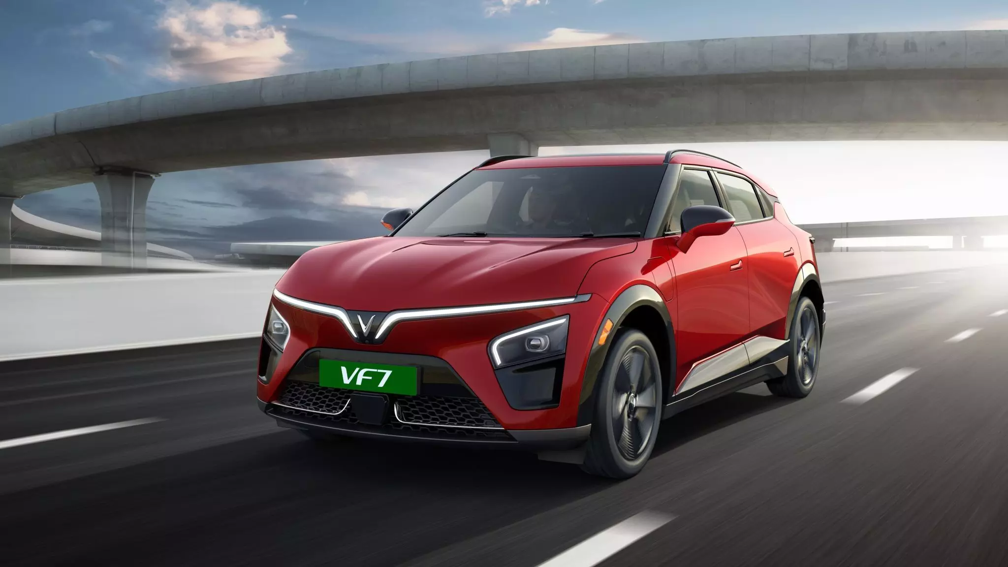 The VF 7 gets sharply designed LED headlights and flush door handles; featured here in Crimson Red paint colour