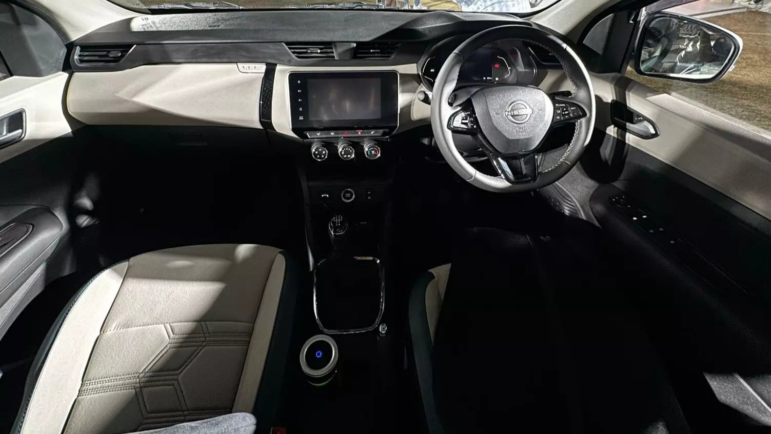 The cabin gets a dual-tone treatment and features physical AC controls; theres a fully-digital gauge cluster and a leather wrapped steering wheel with controls